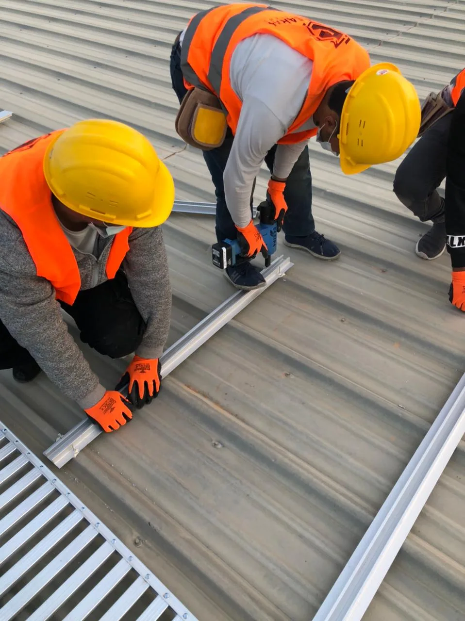 Installation team fixing mounting rails